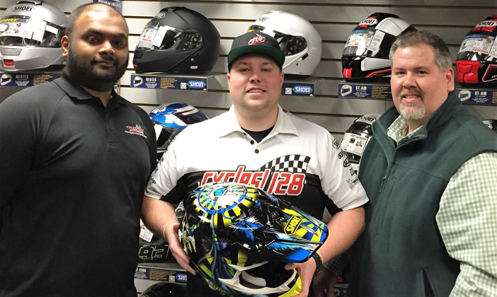 John with his brand new SHOEI VFX-W Grant 2 off-road helmet recently awarded to him by Helmet House Account Representative Mark Przechocki, shown at right.  Cycle 128’s Parts Manager Myooran Nakeswaran is pictured at left.