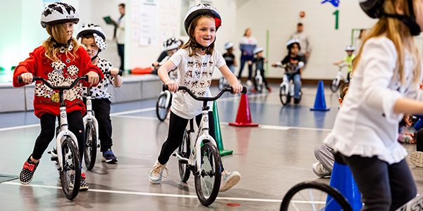 Leeds Primary School students on balance bikes.